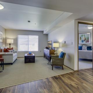 A modern living room with stylish furniture and abundant natural light.