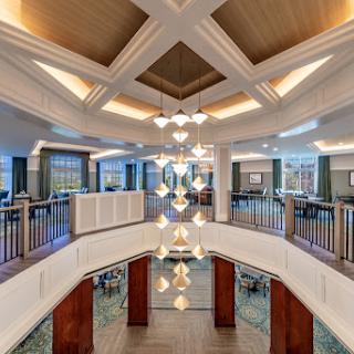 A beautifully designed lobby featuring modern architecture and elegant lighting.