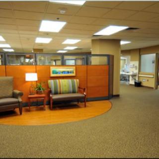 A welcoming office waiting area with comfortable seating.