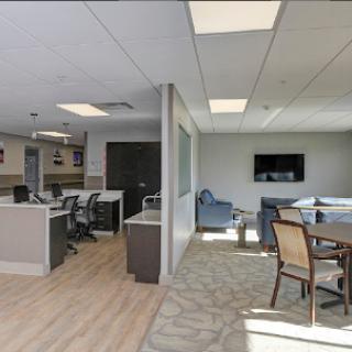 A contemporary office layout featuring modern furniture and an inviting workspace.