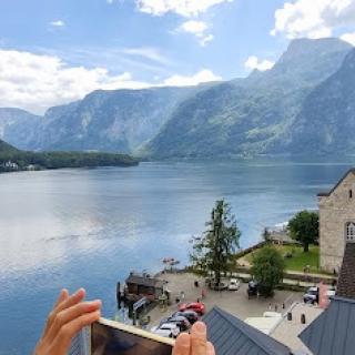 A breathtaking view of the mountains reflecting in a serene lake, perfect for capturing memories.