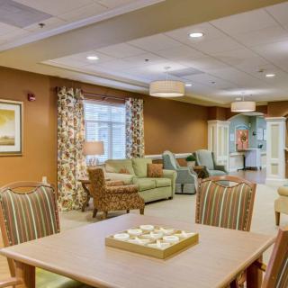 A cozy living room with comfortable seating and elegant decor.