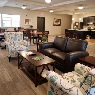 A spacious and comfortable living area with modern furniture and an open layout.