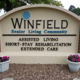 Signage for Winfield Senior Living Community, highlighting services offered.
