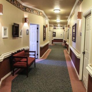 A well-lit corridor with seating and decorative elements.