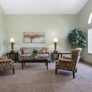 A cozy living room with elegant furniture and decor.