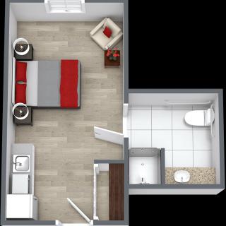 A compact studio apartment floor plan featuring a bedroom, bathroom, and small kitchen area.