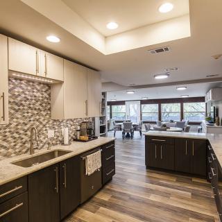 A modern kitchen with sleek cabinetry and an open layout.