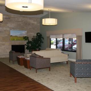 A modern living room with comfortable seating and elegant lighting.
