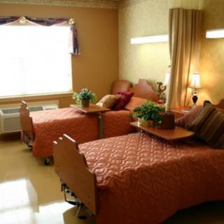A cozy room with twin beds and warm lighting.