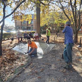 Volunteers working together to improve the local park during a community service event.