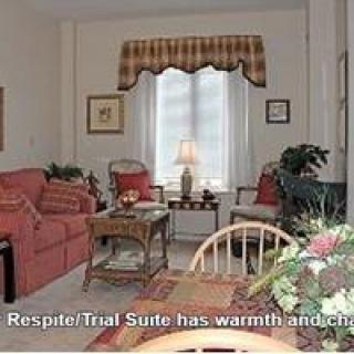 Cozy living room with warm decor and comfortable furnishings.