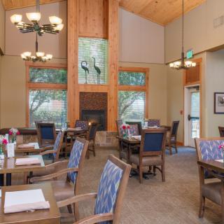 A cozy dining area with ample lighting and comfortable seating.