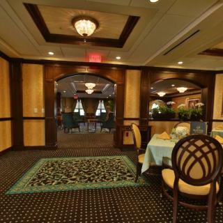 An elegant dining room with classic decor and sophisticated lighting.