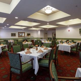An elegantly decorated dining room with tables set for guests.