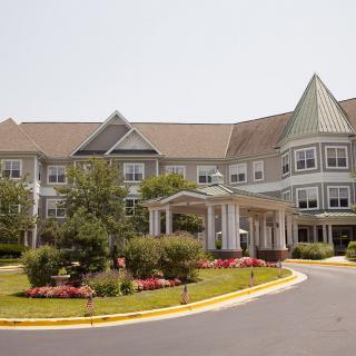 A well-maintained residential building with landscaped gardens and a welcoming entrance.