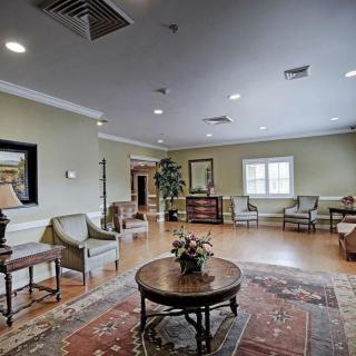 A spacious and elegantly decorated lobby with comfortable seating and warm lighting.