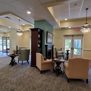 A modern lobby interior featuring comfortable seating and elegant lighting.