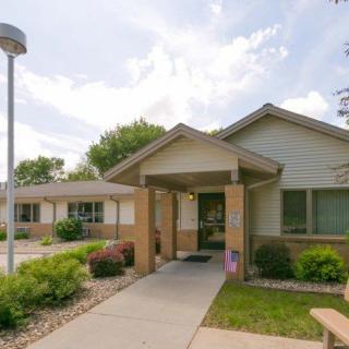 A suburban residential house with a well-maintained front yard and pathway.