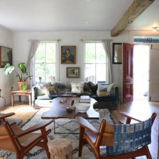 A cozy, modern living room with stylish furniture and bright natural lighting.
