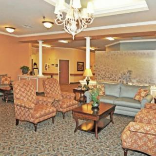 A warmly decorated lobby with comfortable seating and elegant lighting.