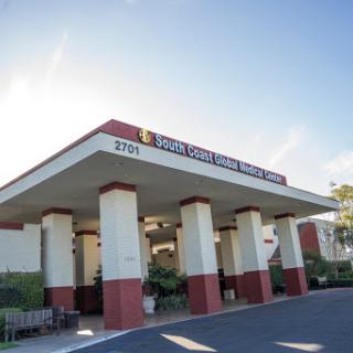 Entrance of a medical facility showcasing modern architecture.