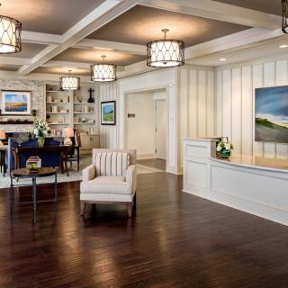 A modern lobby with a comfortable seating area and stylish reception desk.