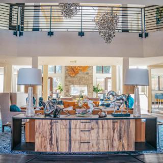 A stylish and modern hotel lobby featuring a wooden reception desk and contemporary lighting.