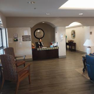 A welcoming reception area with seating and a front desk.