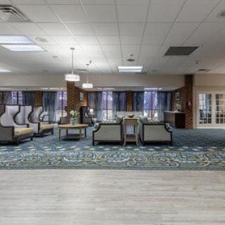 A spacious and modern hotel lobby with comfortable seating arrangements.