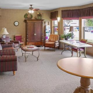 A cozy living room with comfortable seating and ample natural light.