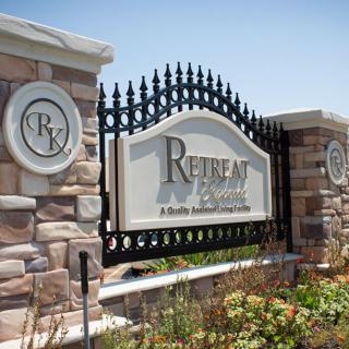 Entrance sign for 'Retreat', a gated residential community.