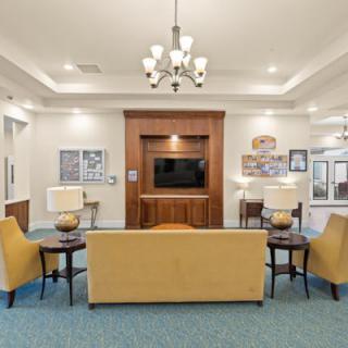 A modern living room with comfortable seating and a television.