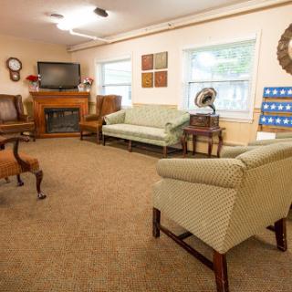 A cozy and inviting living room setup with comfortable seating and a warm ambiance.