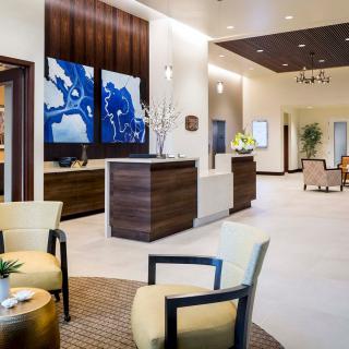 A modern lobby with stylish furnishings and artwork.