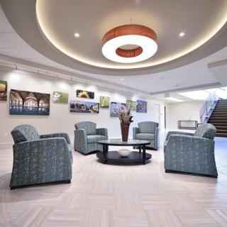 A modern lobby with comfortable seating and decorative artwork.