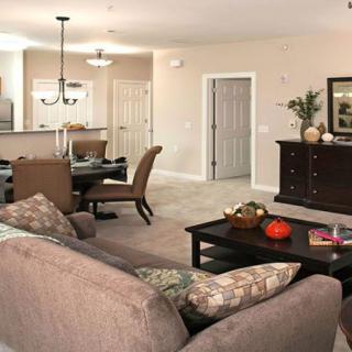 Open-concept living and dining area with modern furnishings.