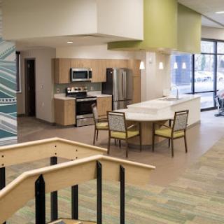 A modern kitchen and dining area featuring sleek appliances and a spacious design.