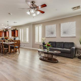 A beautifully designed living and dining area featuring modern decor and ample natural light.