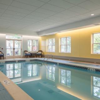 A serene indoor swimming pool area, perfect for relaxation and leisure.