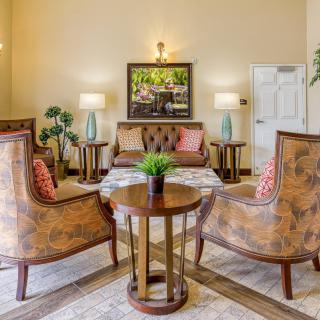 A cozy living room with elegant furniture and decor.