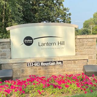 Welcome to Lantern Hill located on Mountain Ave, surrounded by vibrant flowers.