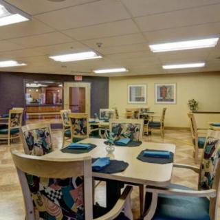 An inviting dining room with neatly arranged tables and chairs, ready for guests.