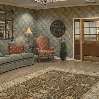 A cozy living room featuring elegant furnishings and decorative elements.