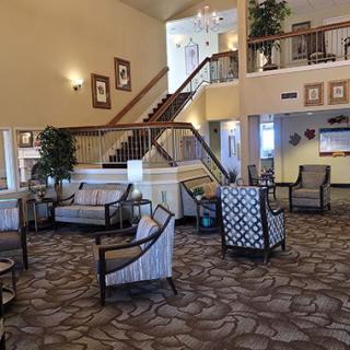 A spacious lobby area with comfortable seating and elegant interior design.