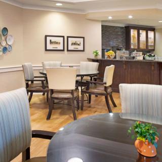 A modern dining area with elegant furniture and contemporary decor.
