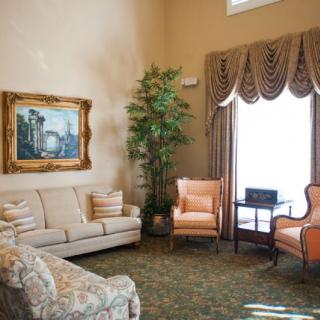 A cozy living room with elegant furniture and decor.