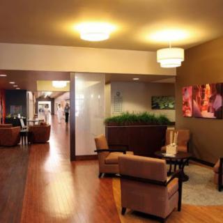 A cozy lobby showcasing modern interior design with comfortable seating and warm lighting.