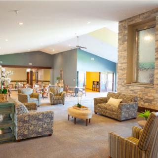A spacious and cozy living room with modern design elements and comfortable seating.