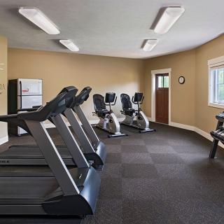 A well-equipped gym with treadmills and exercise bikes.